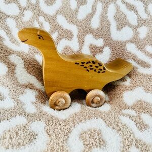 Classic Wooden Handmade Dinosaur. Working Wheels